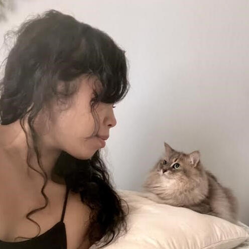 Love of my life Oanh and her cat, Echo, gazing at each other